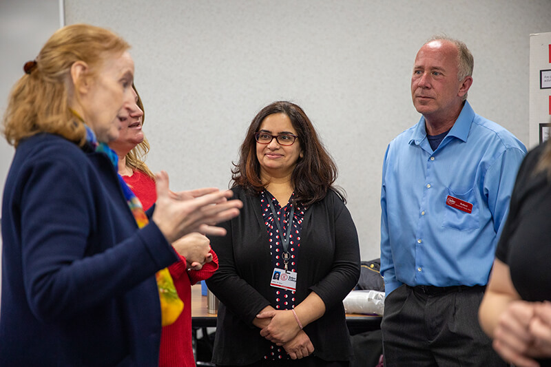 People talk in a classroom setting