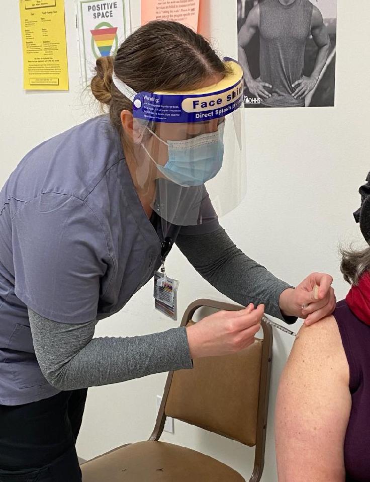 Cadillac nursing student, Christina Ashby, administering the COVID-19 vaccine at the Wexford County District Health Department.