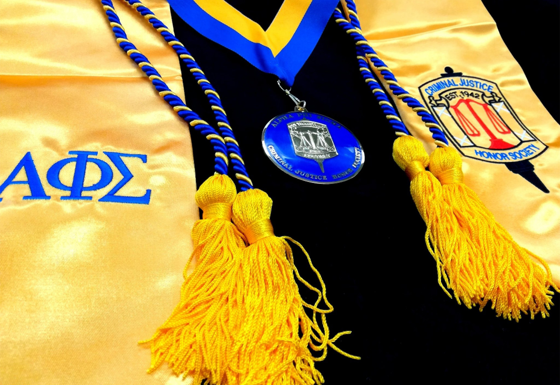 Alpha Phi Sigma graduation regalia