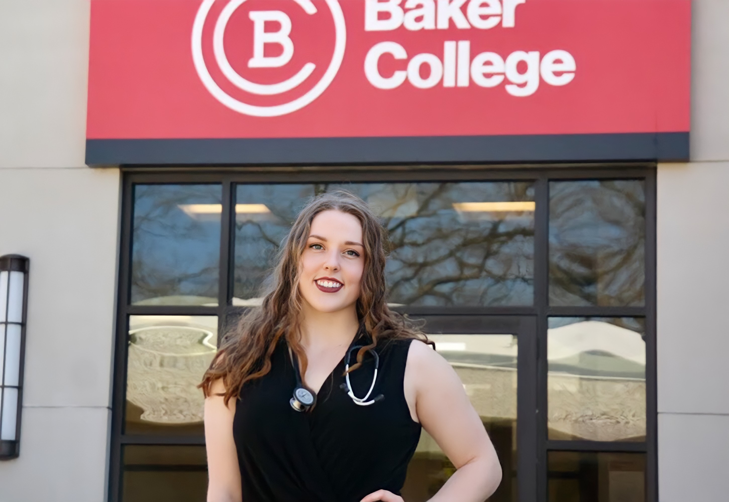 Smiling health science student on a Baker College campus.