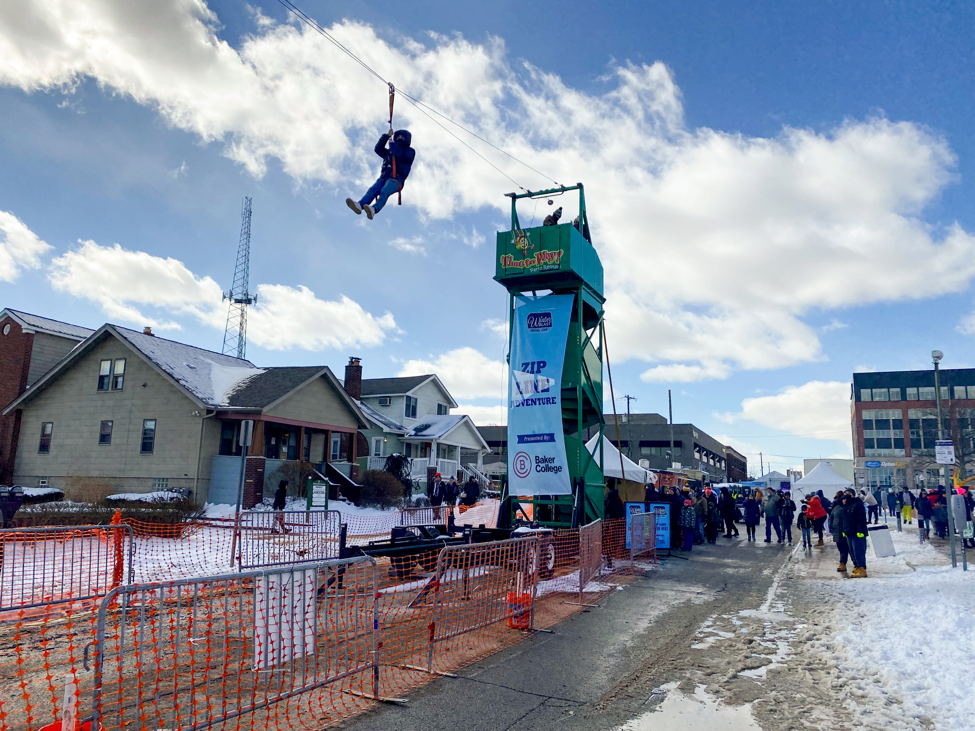 Winter Blast guest riding down the Baker College Zip Line.