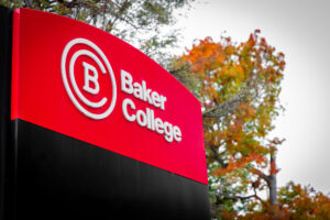 A close-up of a Baker College sign