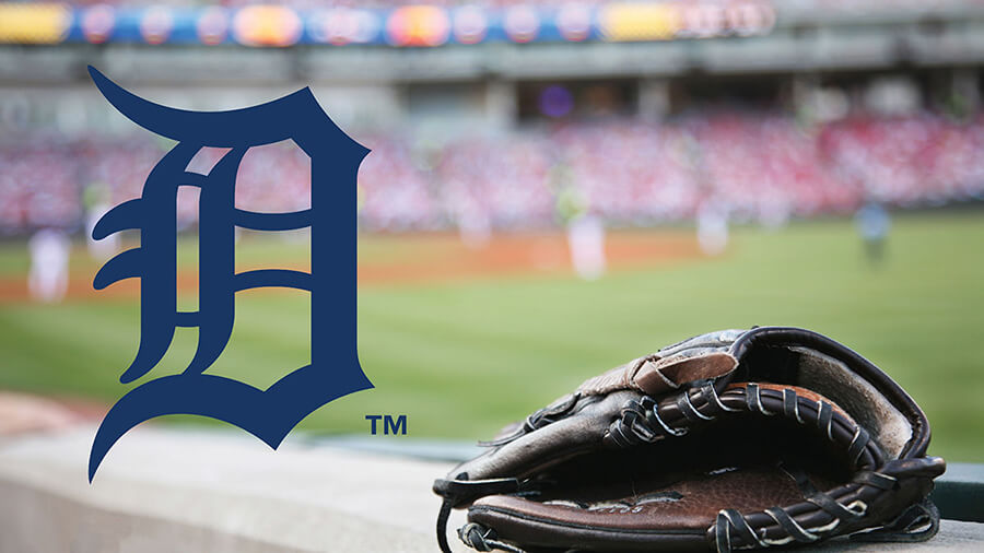 The Detroit Tigers logo overlaid on a photo of a baseball field and catcher's mitt.