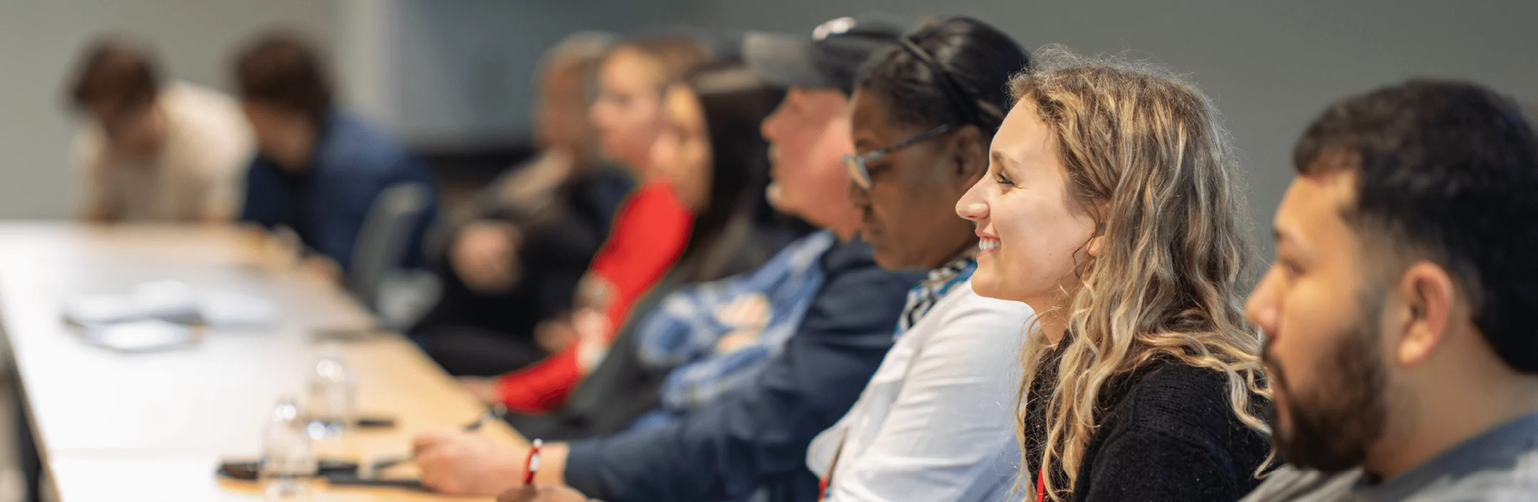 Students smile as they listen in class.