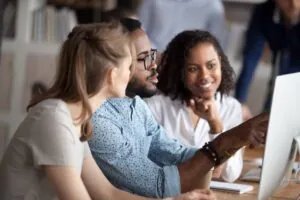 Diverse marketing businesspeople working in shared office.
