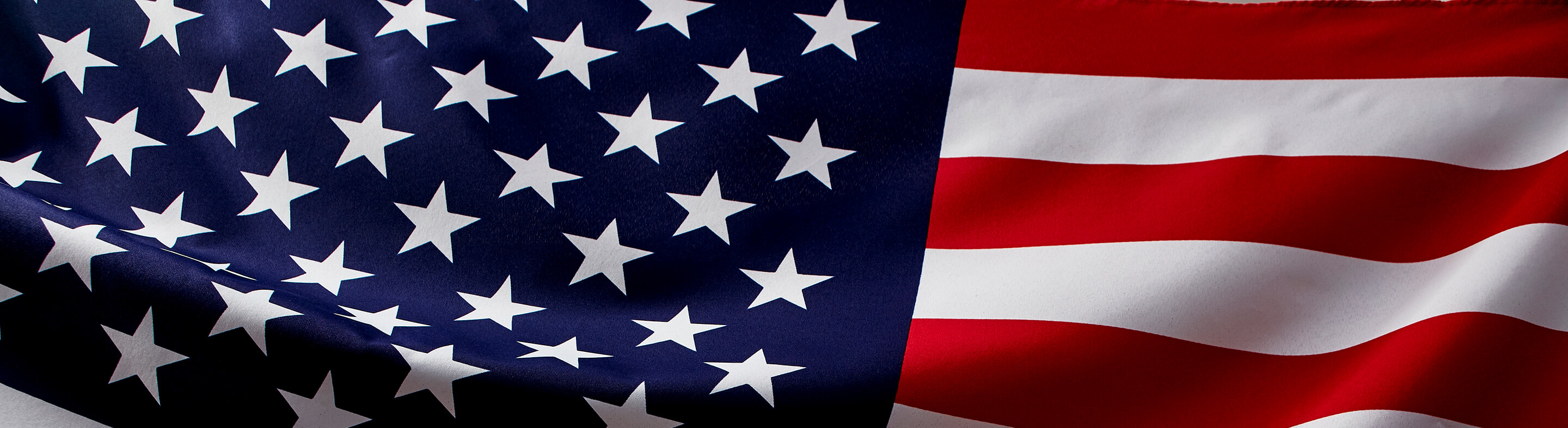 American flag fluttering as seen from close up.
