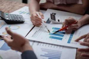 Auditor and accountant team working in office, analyze financial data.