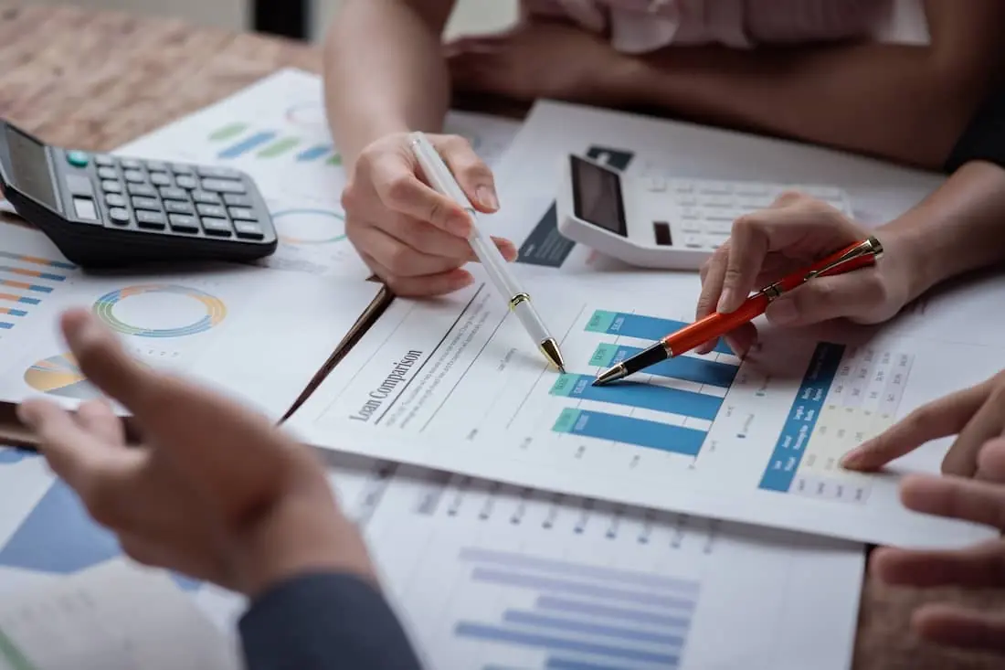 Auditor and accountant team working in office, analyze financial data.