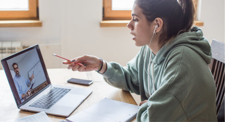 Student talking to professor over Zoom.