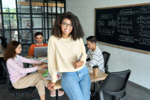Students working at desk on project in contemporary classroom.