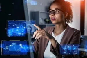 Woman information security analyst working in the office and digital technology concept.