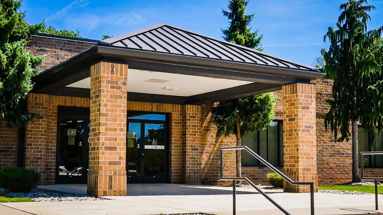 Jackson campus exterior showing a brick building with a covered doorway