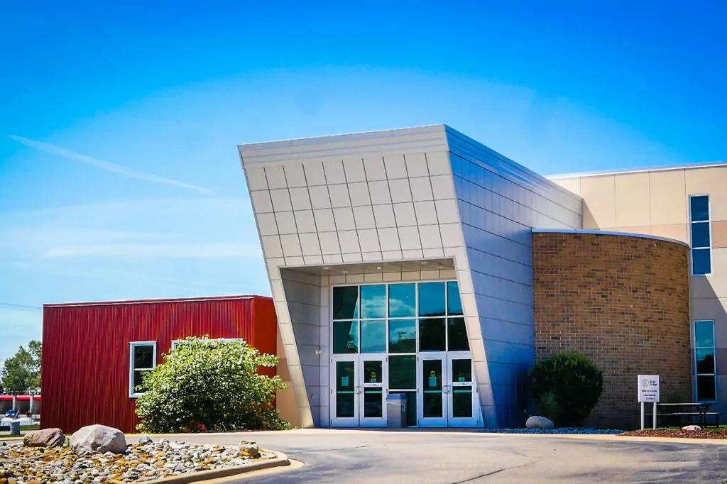 An exterior photo of the Jackson campus against a bright blue sky.