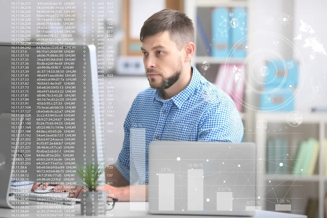 Concept of management information systems. Man working with computer at table in office.