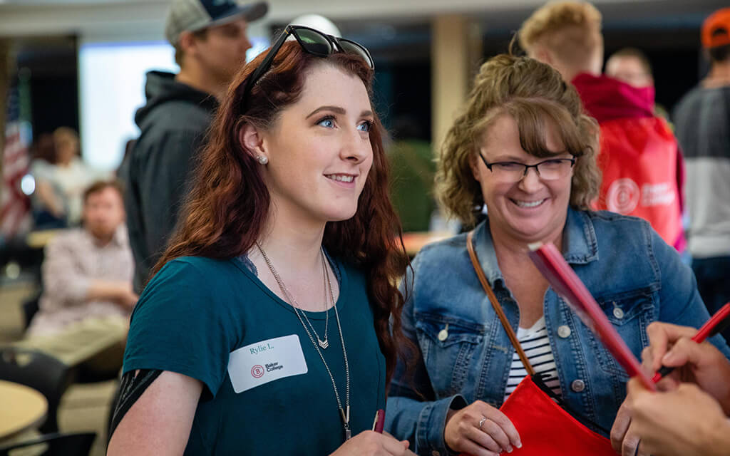 A student and parent talk to an advisor.