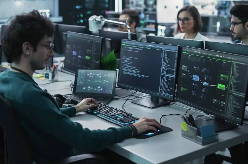 Team of Diverse Software Developers Working on Codeand Managing Artificial Intelligence Projects Online for a Cybersecurity Technology Company