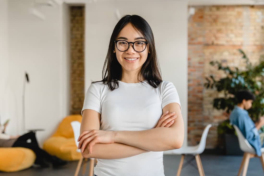 Successful young asian social worker at her office.