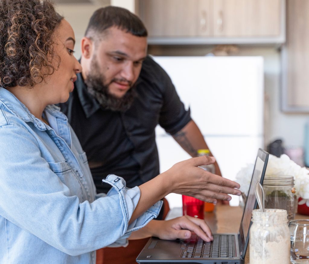 Couple viewing a computer.